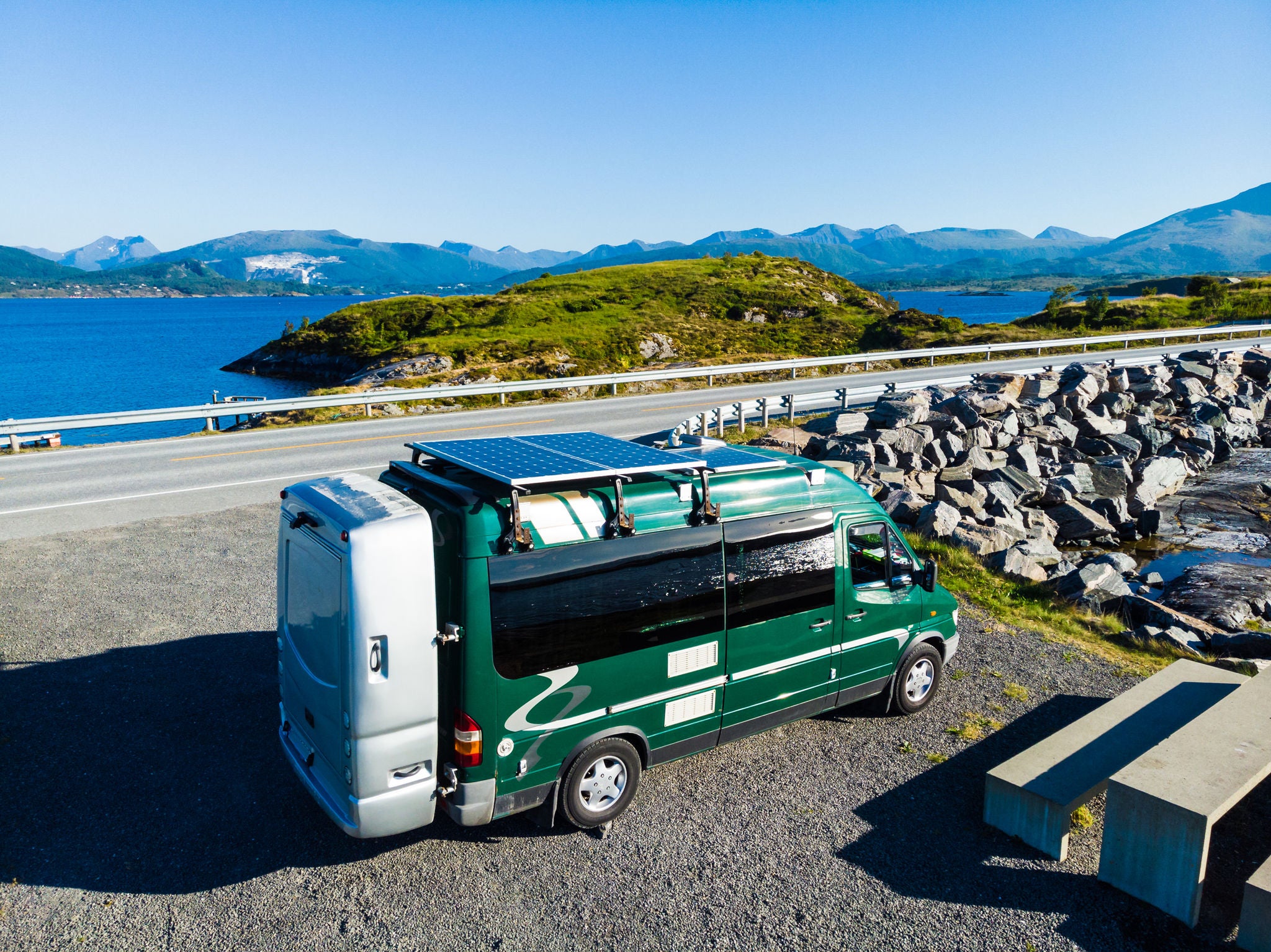 Motorhome camper car with solar panels on roof on rest stop area at Atlantic road, norwegian national tourist scenic route Ryfylke.