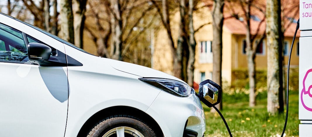 Electric car being charged