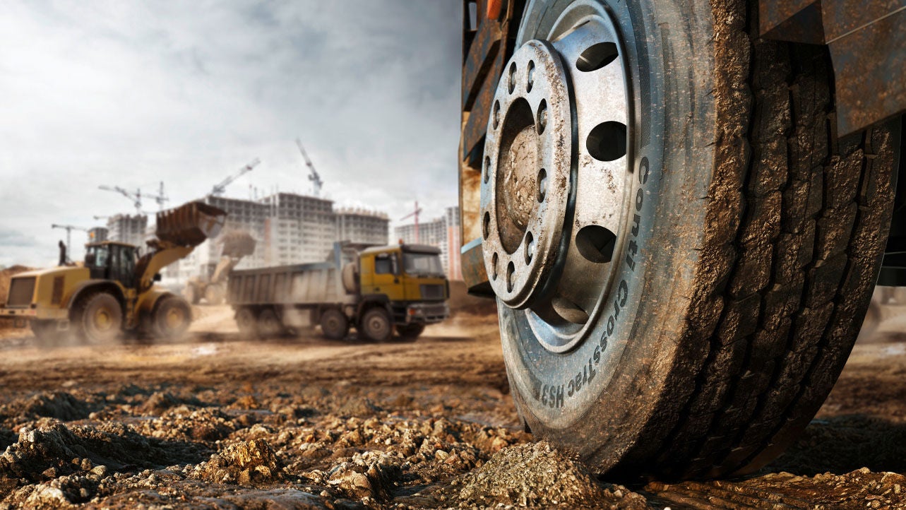 Truck drives into a construction site