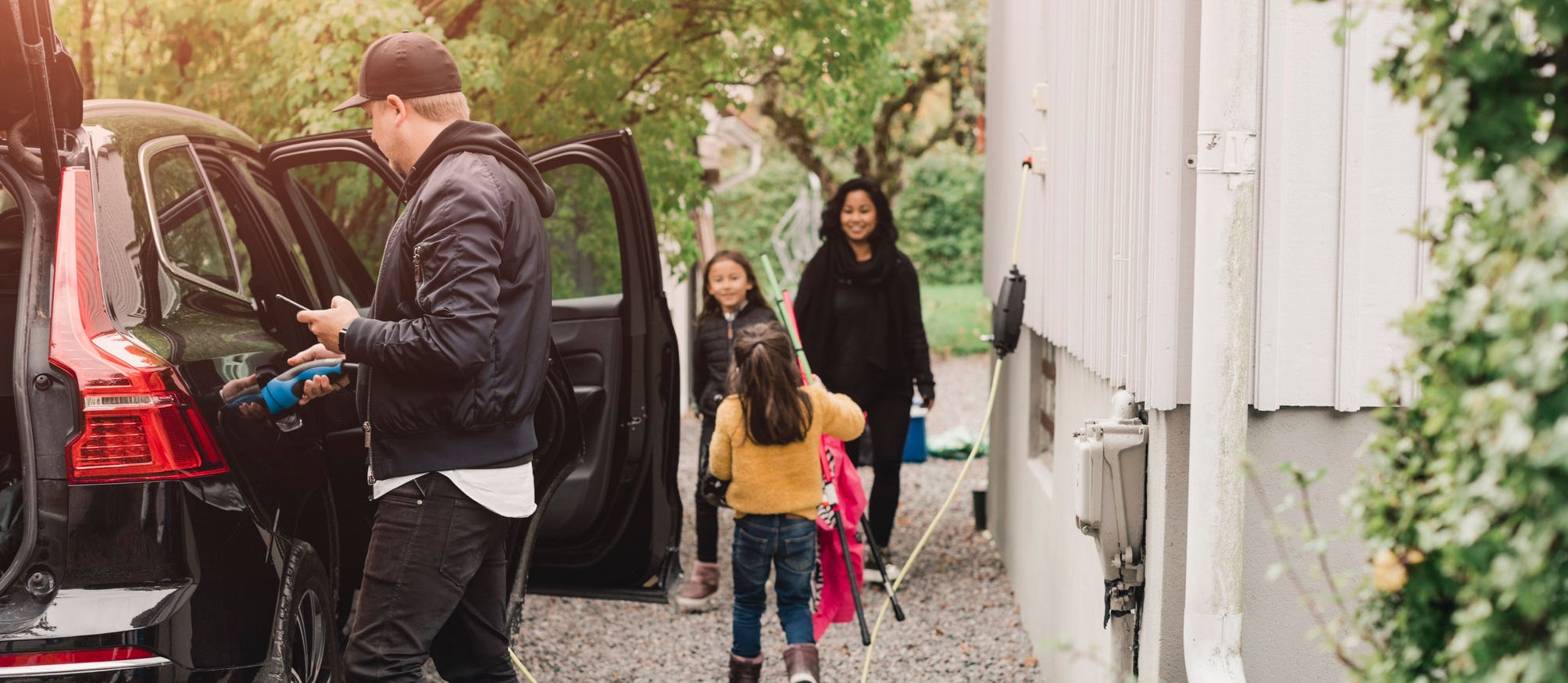 A family is prepairing their car for the next trip.