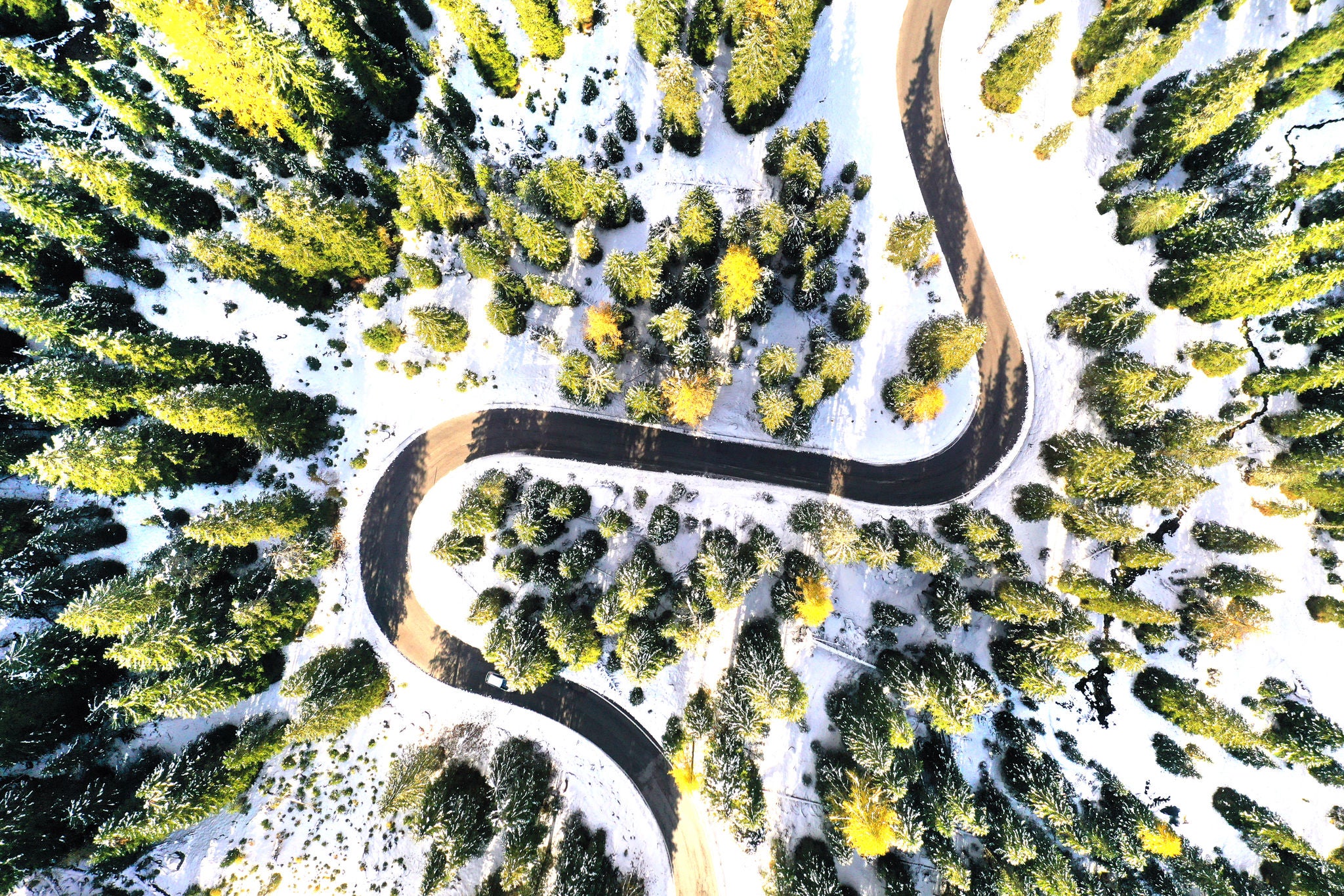 Aerial drone view of windy road during winter