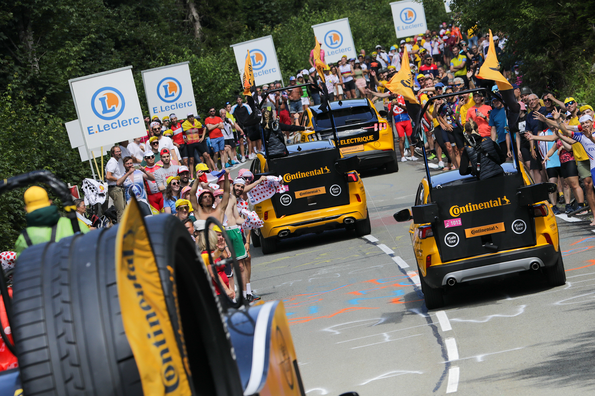 Continental advertising caravan among the passionate fans waiting along the route for the riders. 